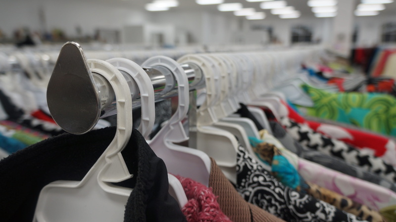 in a row, retail display, city, clothing, mannequin, thrift store, small business, hangers, day, focus on foreground, clothes, shopping, variation, consumerism