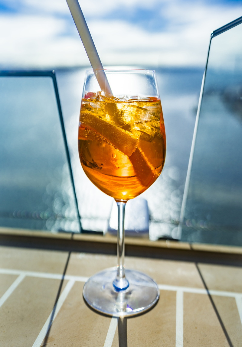 having a drink, straw, outdoors, cocktail, glass - material, goblet, lager, orange juice, beverage, juice, drink, refreshment, 5K, freshness, liquor, wineglass
