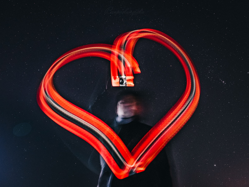 black background, rose, red, love, trademark, shape, smoke pipe, light, night, indoors, shaped, lighting equipment, technology, logo, alphabet, 5K, heart