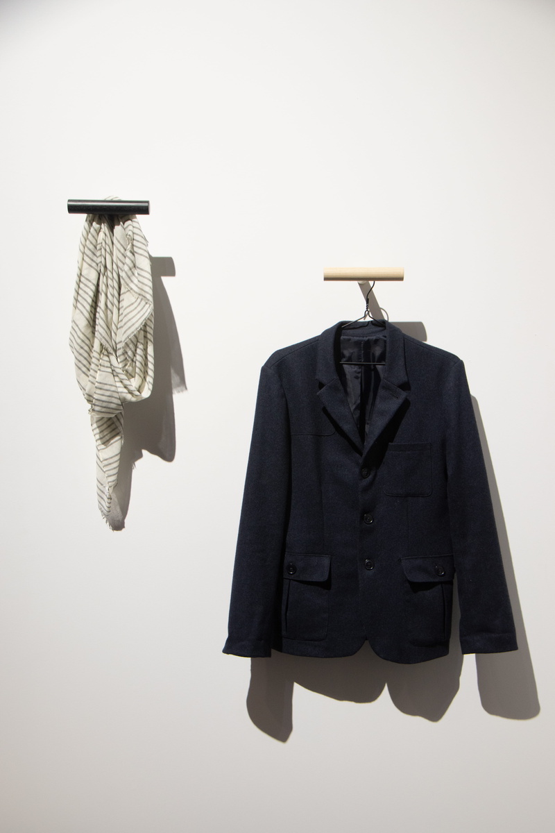 suit, apparel, tuxedo, fashion, long sleeve, coat hook, man, human representation, white color, coat, person, coathanger, clothing, bird, still life, sleeve