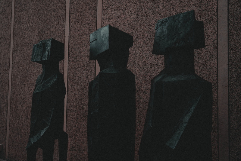 agelaius, two objects, statues, bird, human representation, still life, clothing, black color, wall - building feature, blackbird, asphalt, three, tarmac