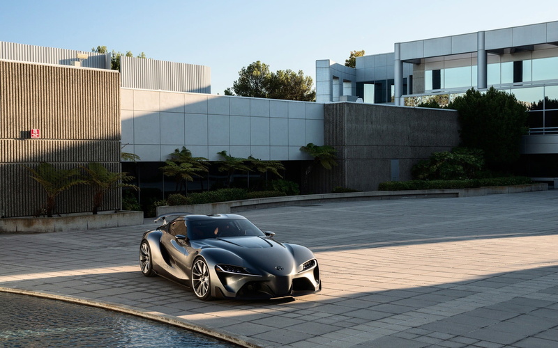 white, built structure, outdoors, car, road, concept cars, footpath, boat, no people, mode of transportation, Toyota, street, sky, black, building exterior