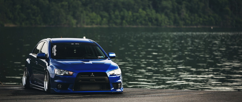 water, car, 2K, blue, motor vehicle, selective focus, plant, nature, land vehicle, focus on foreground, no people, tree, stationary, ultra-wide, mode of transportation