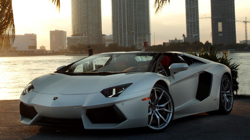 tower, sky, cityscape, lamborghini, nature, 1080P, land vehicle, super car, outdoors, roadster, modern, mode of transportation, city, architecture, day