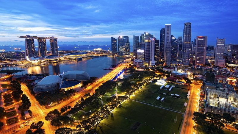 urban skyline, architecture, tower, high angle view, financial district, city, road, illuminated, water, nature, buildings, cityscape, aerial, building exterior