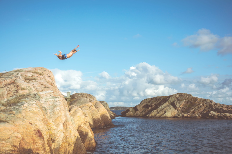 beauty in nature, ocean, human limb, flying, lapse, youth, nature, lake, coast, arms raised, sea, rock formation, cliff, outdoors, person, leisure activity