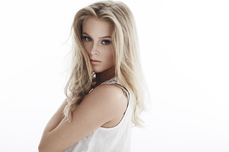 profile, looking at viewer, blue eyes, Zara Larsson, dress, simple background, girl, white background, singer, portrait, tattoo, looking at camera, white dress