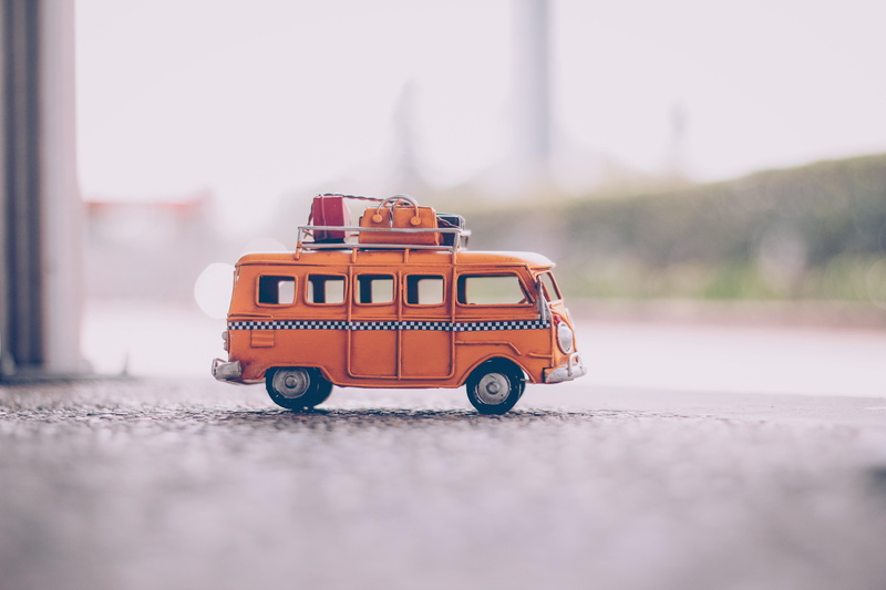 city, toy, small, outdoors, car, miniature, mode of transportation, selective focus, vehicle, 5K, cast, van, transportation system, motor vehicle, automotive