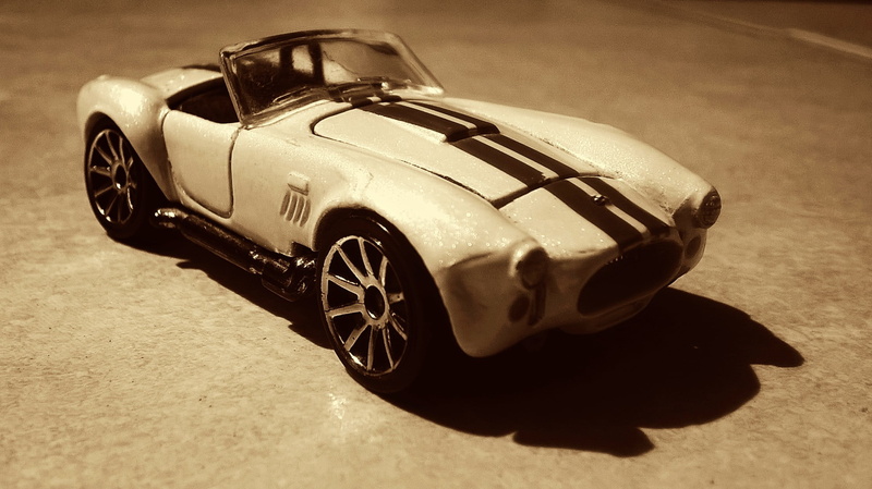 sport, car, motor vehicle, retro styled, cast, day, toy, transportation, sunlight, toy car, stationary, close-up, high angle view, 1080P, luxury, focus on foreground