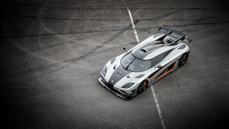 silver colored, single object, 1080P, high angle view, mode of transportation, motor vehicle, auto racing, wheel, sports race, racecar, Koenigsegg, motorsport
