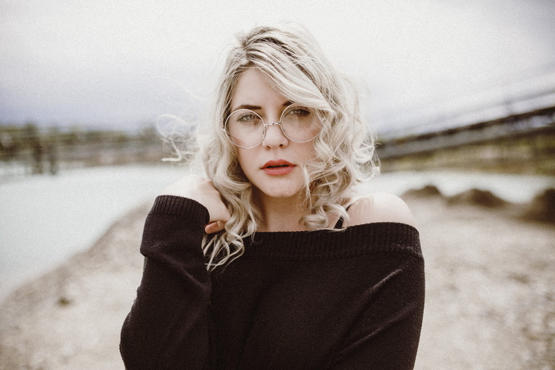 portrait, 1080P, glasses, women with glasses, blonde, bokeh, pale, black clothing, women, women outdoors, face, noisy