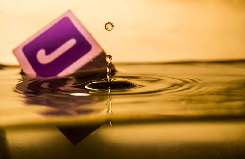 motion, block, falling, nature, water, no people, indoors, yellow, impact, purity, splashing, colored background, floating, water drop, purple, studio shot
