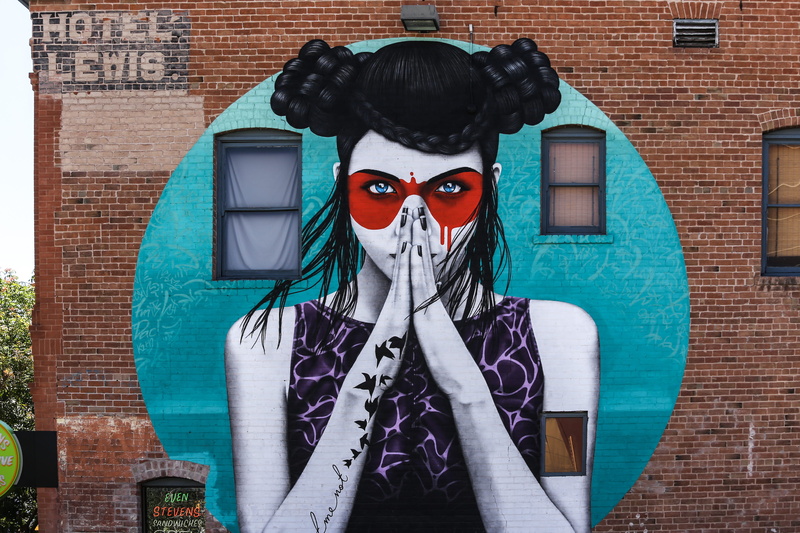 brick, decoration, woman, front view, looking at camera, large, representation, creativity, blue, colorful, mask, building exterior, painting, built structure