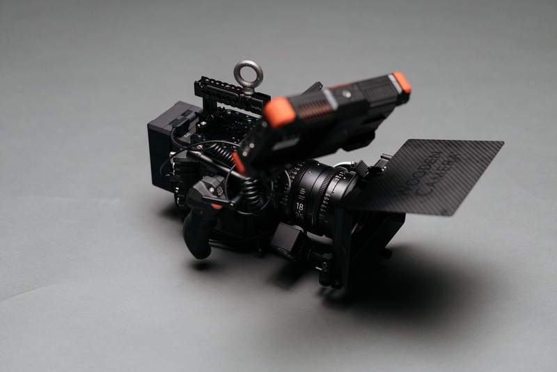 indoors, machine, no people, single object, studio shot, table, matte box, black color, text, high angle view, video camera, equipment, gray, still life