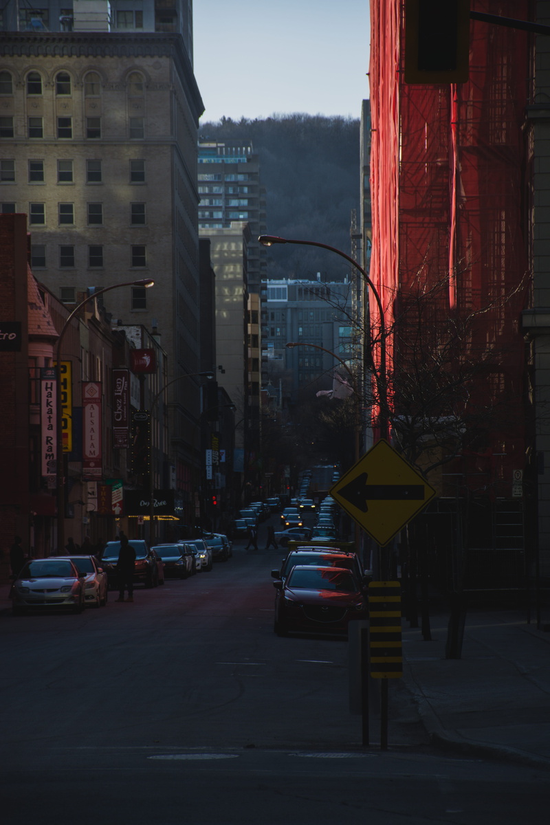 motor vehicle, city street, travel, motion, dawn, road sign, pavement, no people, architecture, light, highway, nature, dusk, downtown, street corner, yellow