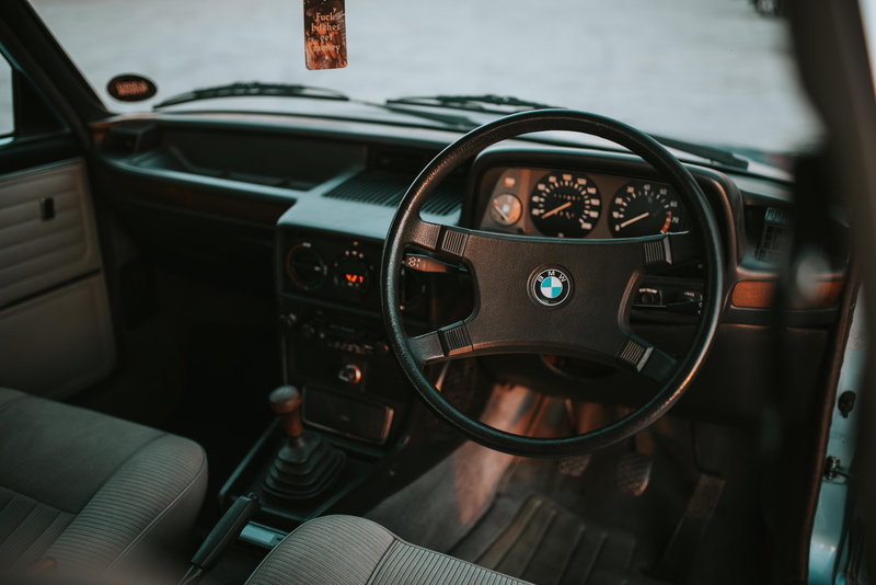 wheel, control, gearshift, focus on foreground, indoors, electronics, steering wheel, logo, car, car interior, transportation, interior, control panel