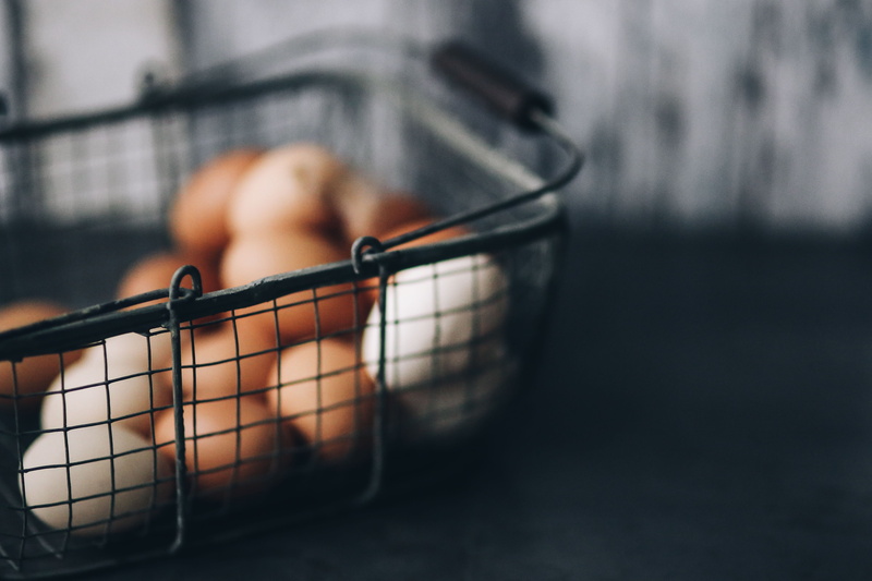 selective focus, metal, indoors, basket, human body part, women, focus on foreground, one man only, blurred motion, wire, close-up, day, motion, one person