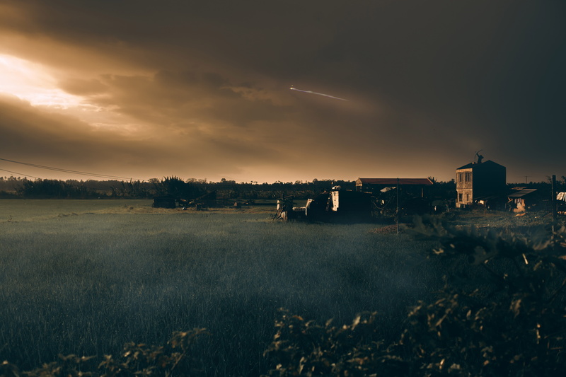 dark, beauty in nature, bow, sunset, banana, archer, nature, trees, farm, land, residential district, tranquility, barn, fire, grass, outdoors, built structure