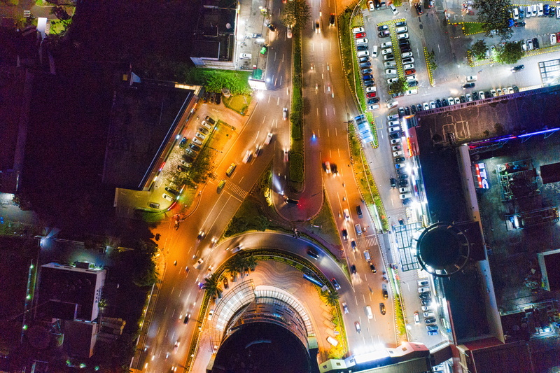 aerial, trees, sign, land vehicle, light streaks, motor vehicle, modern, city life, streets, building exterior, high angle view, city lights, city street
