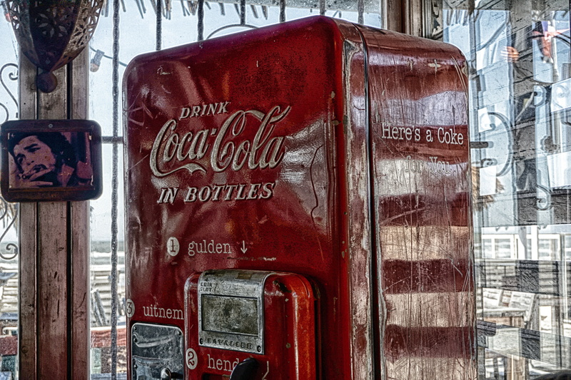non-western script, outdoors, graffiti, sweet, weathered, architecture, coke, script, automatic, summer, logo, brand, close-up, day, drink, advertising