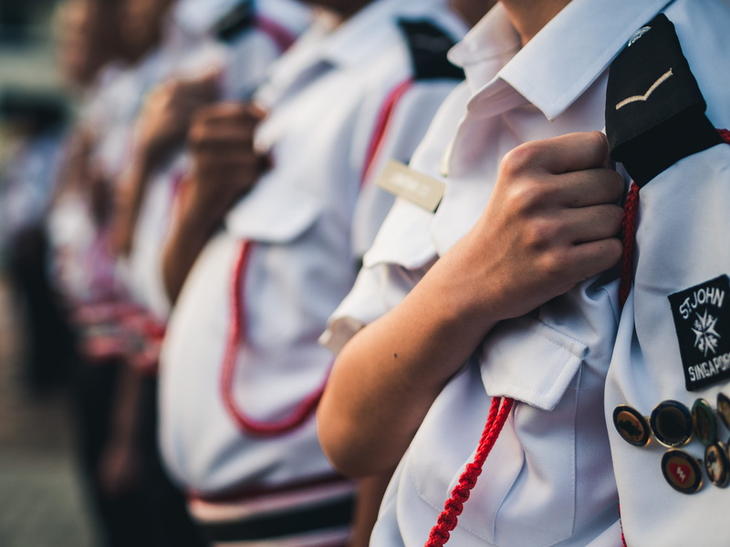 focus on foreground, outdoors, law, midsection, occupation, close-up, power, event, adult, brigade, singapore, daytime, duty, putting, military uniform