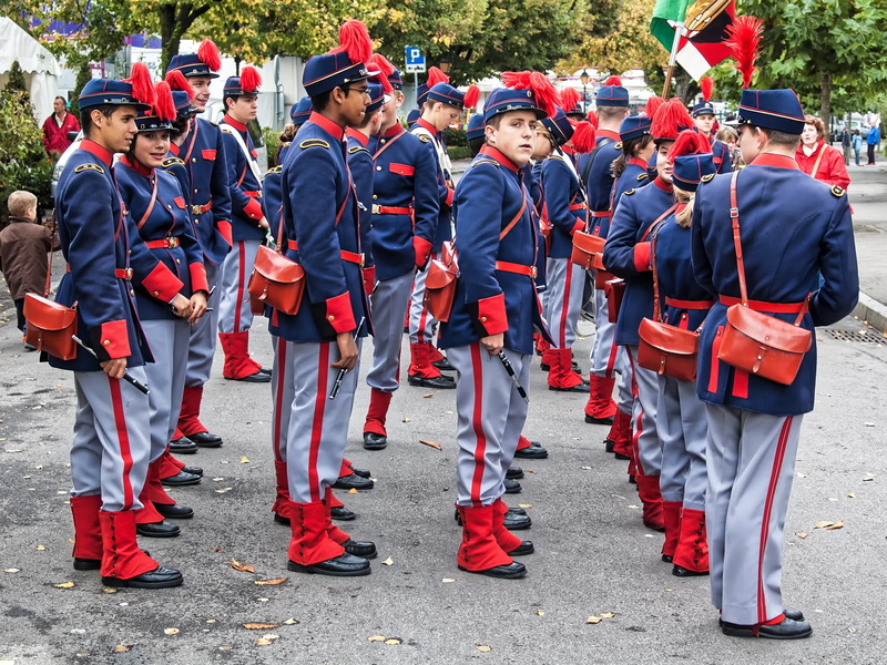 uniform, force, city, group of people, red, 2K, men, marching band, celebration, standing, crowd, togetherness, parade, military, real people, outdoors