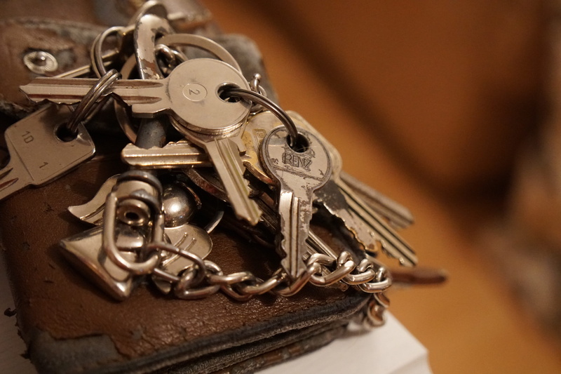 door key, focus on foreground, musical instrument, car keys, classical music, metal, high angle view, close-up, 5K, single object, key chain, machinery