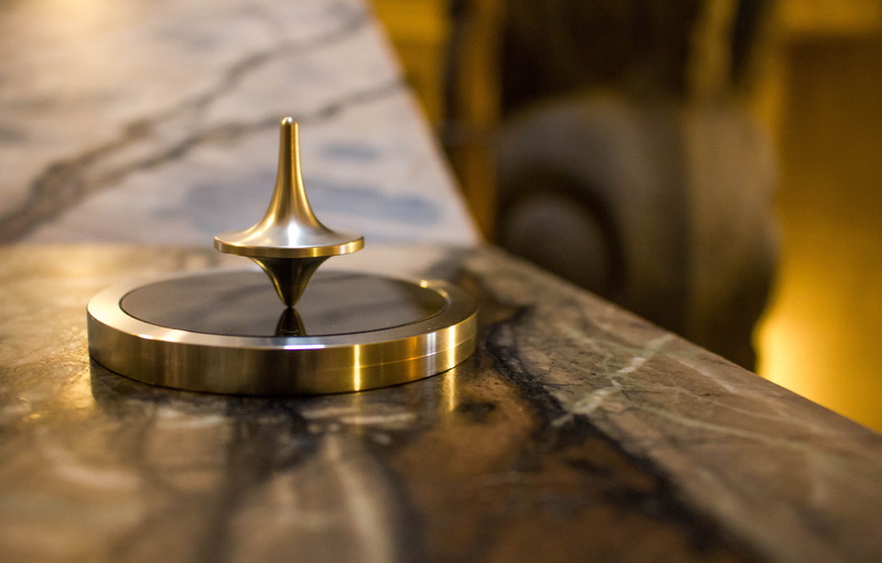 spinning, table, setting, two objects, close-up, indoors, wood - material, metal, top, food, wealth, steel, tool, no people, selective focus, close, selective