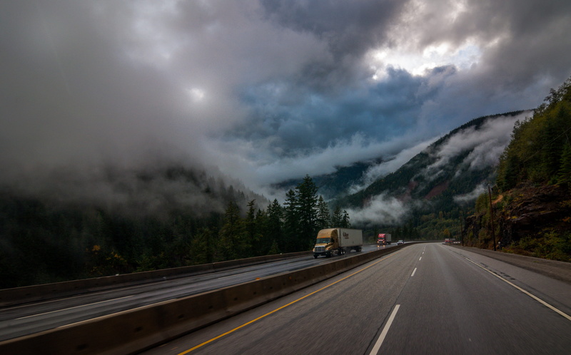 no people, rain, dirt road, sky, yellow, way, coquihalla pass, land vehicle, transportation, truck, canada, direction, motor vehicle, mode of transportation