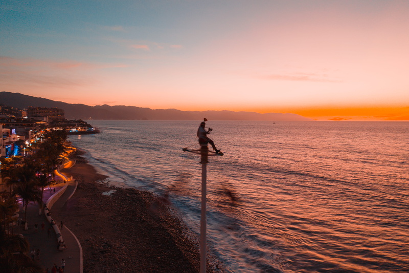 full length, sunset, dusk, leisure activities, 5K, men, orange color, outdoors, flare, dawn, sunlight, sport, red sky, real people, sky, scenics - nature
