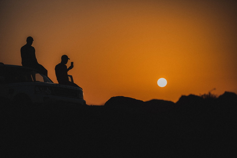 sun, outdoors, human, sunrise, scenics - nature, copy space, flare, full moon, sunset, men, orange color, people, women, adventure, beauty in nature, building