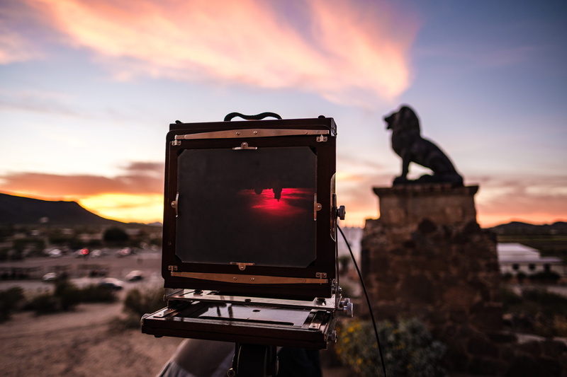 arizona, outdoors, video camera, large format, electronics, bird, cloud - sky, communication, animal, monitor, sunset, tucson, architecture, focus on foreground