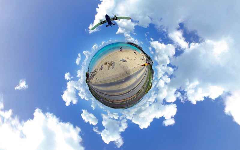panoramic sphere, digital composite, beach, sphere, sunlight, airplane, surreal, built structure, clouds, day, black, reflection, no people, green, sky