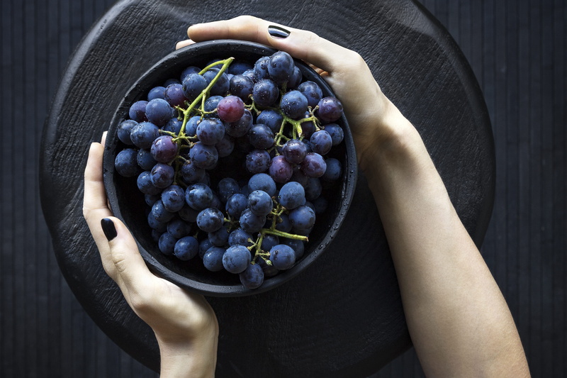 human body part, round, hand, one person, fruit, ripe, women, hands cupped, food, grape, healthy Eating, human Hand, blue, slab, wellbeing, holding, person