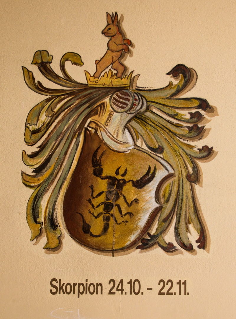 gold colored, art, indoors, signs of the zodiac, the past, decoration, craft, zodiac sign, communication, human representation, creativity, yellow, floral