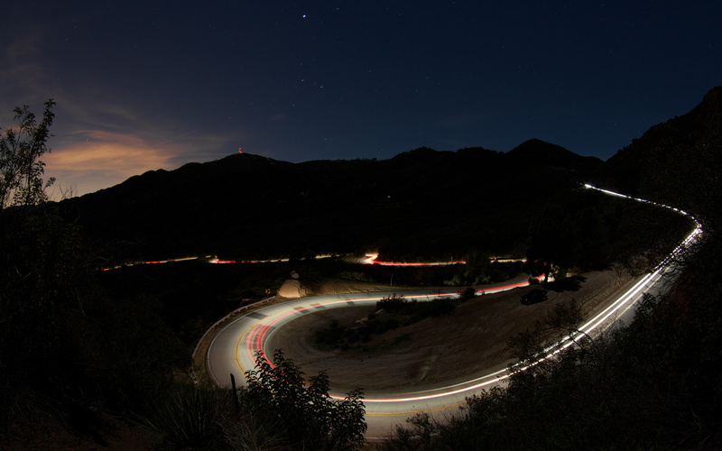 road, astronomy, nature, illuminated, 2K, curve, mountain range, transportation, sky, space, mountain, beauty in nature, motion, tree, california, star - space