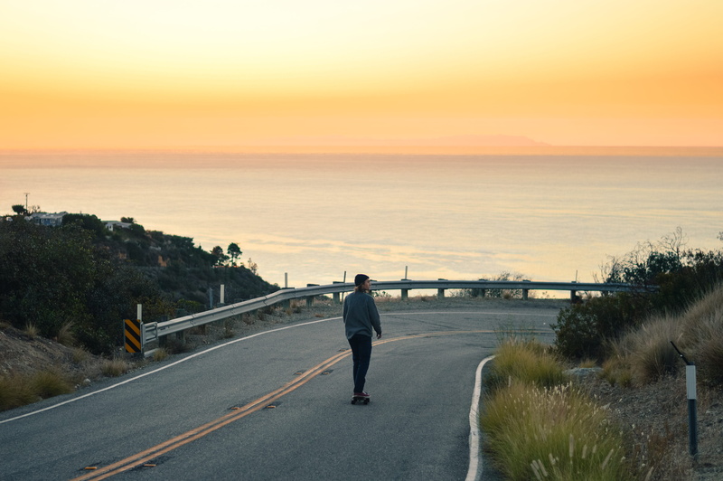 beauty in nature, scenics - nature, transportation, outdoors, water, sky, united states, sunset, shredding, road, men, skating, horizon, nature, leisure activity