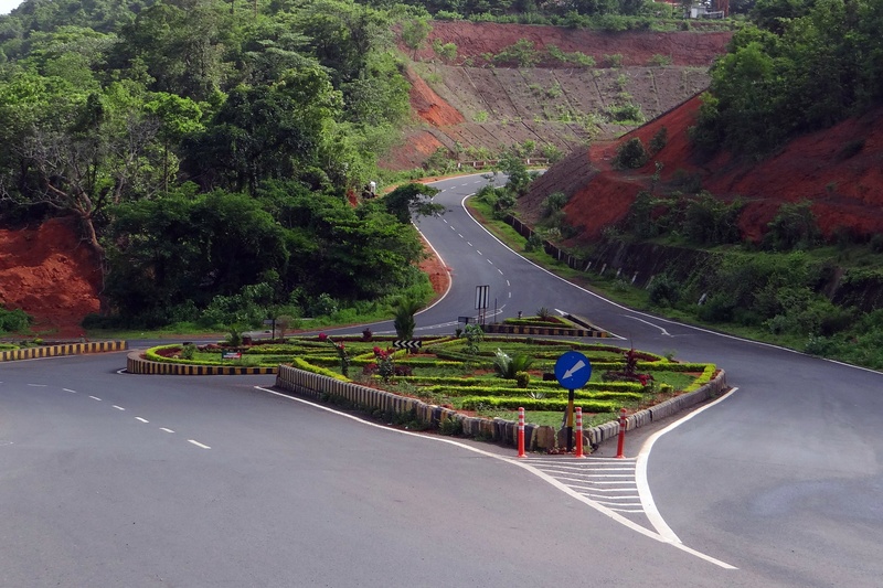 symbol, tree, outdoors, car, india, direction, road marking, no people, sign, street, mountain, winding road, hill road, plant, marking, road intersection
