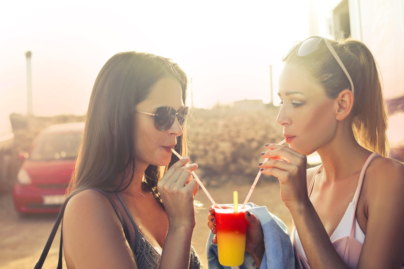 cup, fashion, two, bonding, glass, alcohol, portrait, food and drink, refreshment, drinking, drinking straw, outdoors, beauty, people, hairstyle, headshot