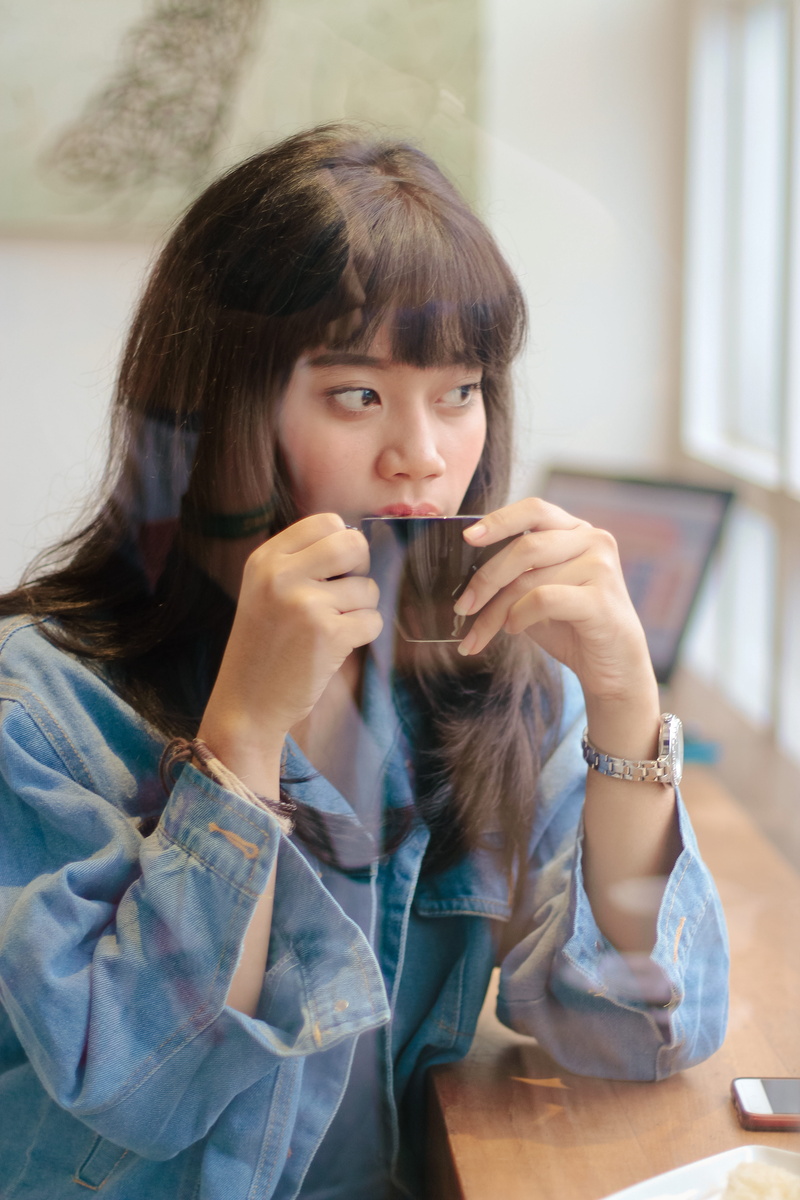 women, pretty, hair, indoors, casual clothing, cup, beautiful woman, portrait, woman, lifestyles, girl, sitting, drink, bangs, sipping, one person, young adult