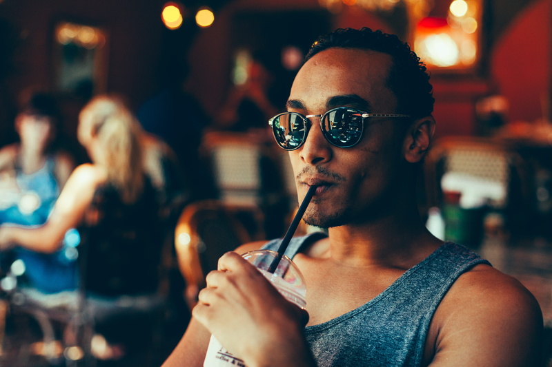 eyeglasses, portrait, sitting, real people, sunglasses, women, indoors, incidental people, cooler, framed, closeup, man, young Men, person, adults Only