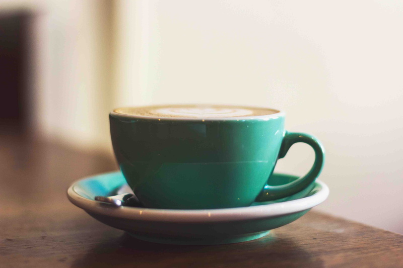 frothy drink, crockery, united states, coffee, coffee cup, cup, still life, college, aesthetic, tea cup, green color, table, focus on foreground, latte