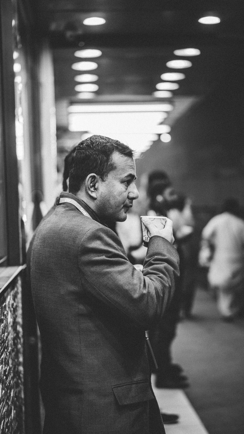 people, photo, leisure activity, side view, transportation, sip, adult, young adult, standing, coffee, public transportation, paper, photography, focus