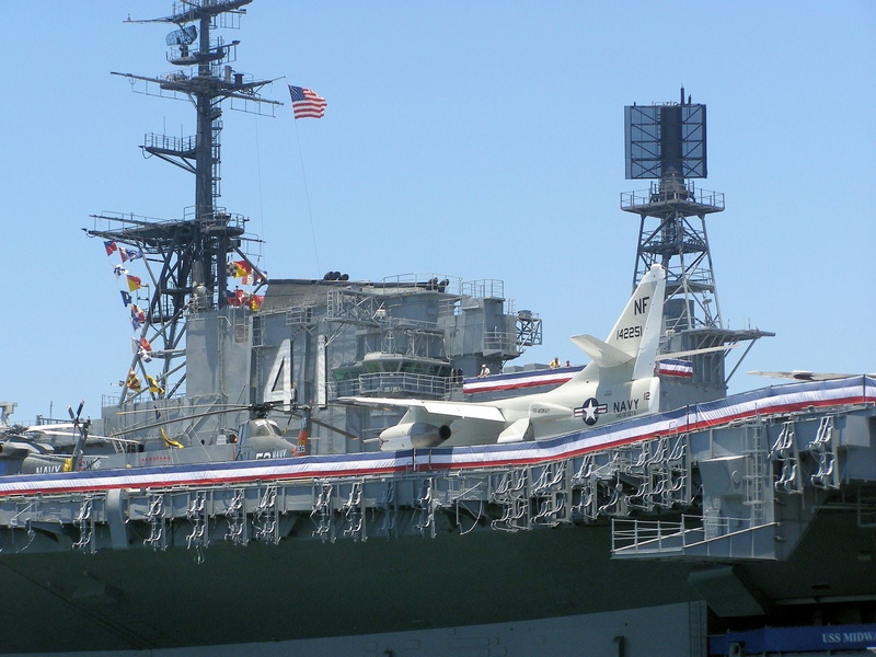 building exterior, warship, day, clear sky, architecture, ship, sky, flag, USS Midway, nature, communication, museum, harbor, patriotism, San Diego, mode of transportation
