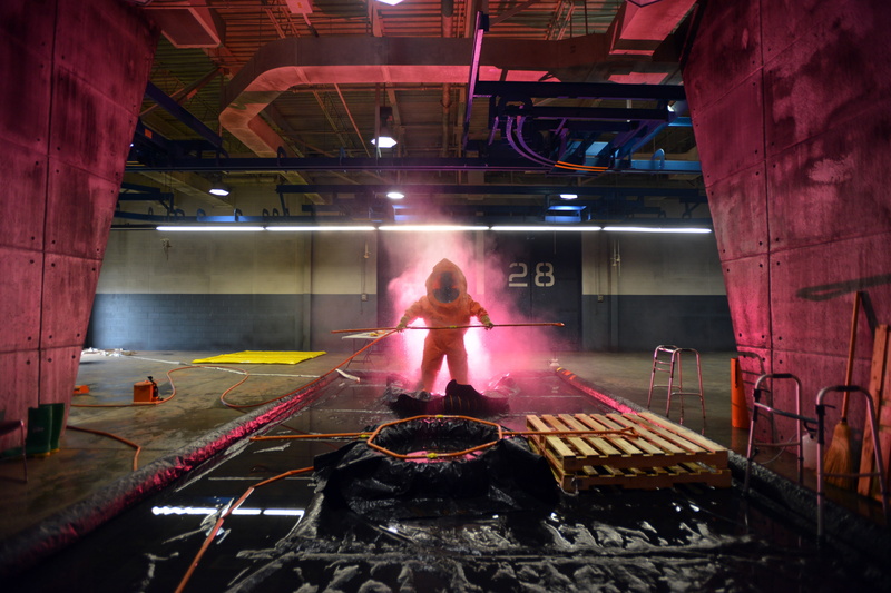 arts culture and entertainment, wear, hazardous, technology, mask, sitting, architecture, decontamination, leisure activity, adult, 5K, real people, rear view