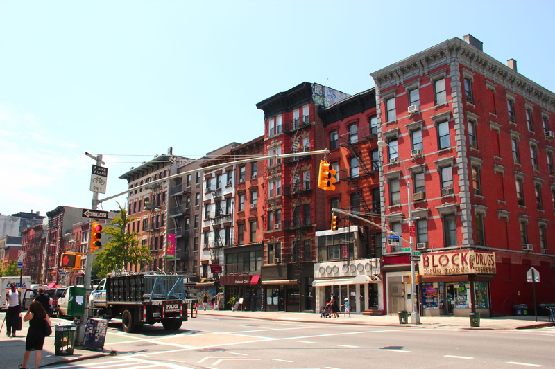 incidental people, outdoors, nyc lower east side, cross streets, land vehicle, sunlight, intersection, 2nd, old buildings, street, city, nyc, lower east side