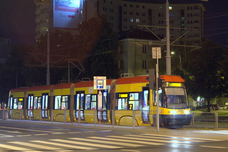 street, building exterior, stop, Tram, yellow, package, motion, mode of transportation, no people, Transport, built structure, agglomeration, red, rail transportation