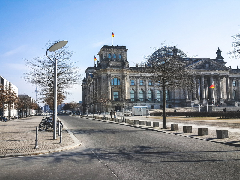 street, blue sky, flag, germany, plant, reichstag building, german flag, built structure, incidental people, tree, reichstag, day, alexander platz, road