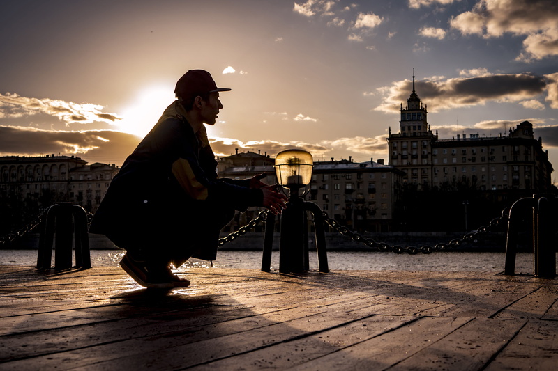 squatting, man, bridge, sky, leisure activity, lifestyles, outdoors, cloud - sky, sunlight, travel, silhouette, water, lonely, calm, dawn, near, city, full length