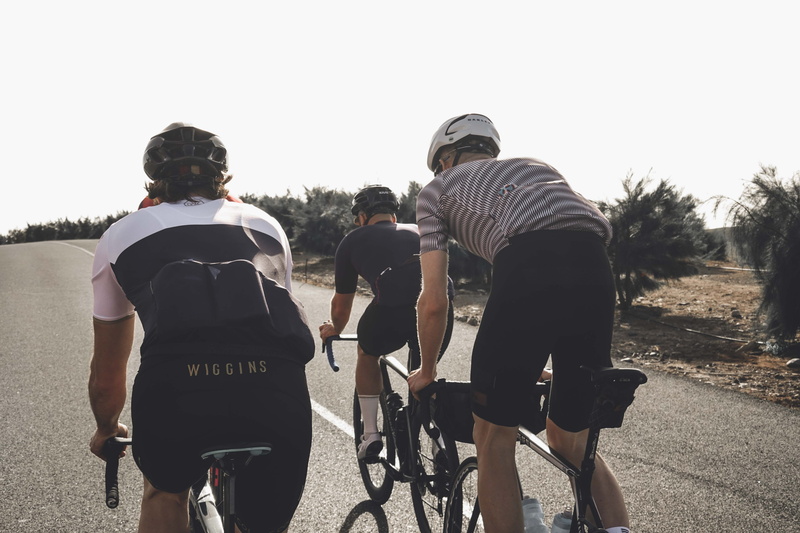 biking, machine, vehicle, sky, day, group of people, back, rear view, clothing, daytime, tire, people, mountain bike, leisure activity, road, nature, casual clothing